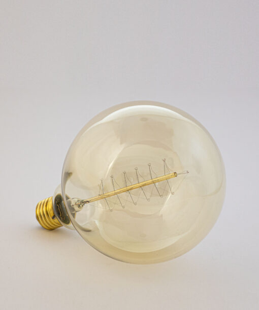 Edison Globe bulb laying on a white table