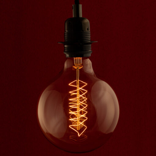 Edison G125 Globe Spiral incandescent light bulb on red Background