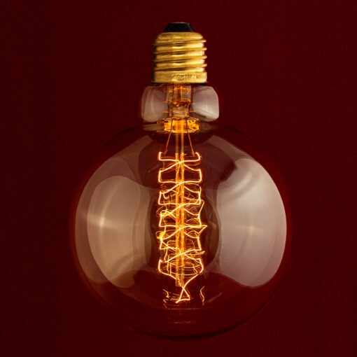 Edison E27 G125 Globe Spiral incandescent light bulb on red Background