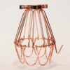 Rose Gold Industrial Cage on white table