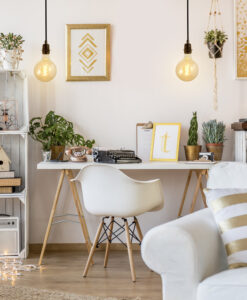 Globe spiral edison bulb hanging from the ceiling in a home office bedroom