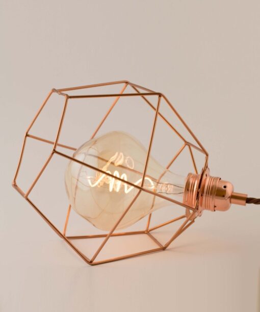Rose gold Hexagon cage with Melt LED bulb On the table side view