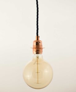 Pendant celing light in Rose gold with G125 Globe edison bulb hanging from Ceiling